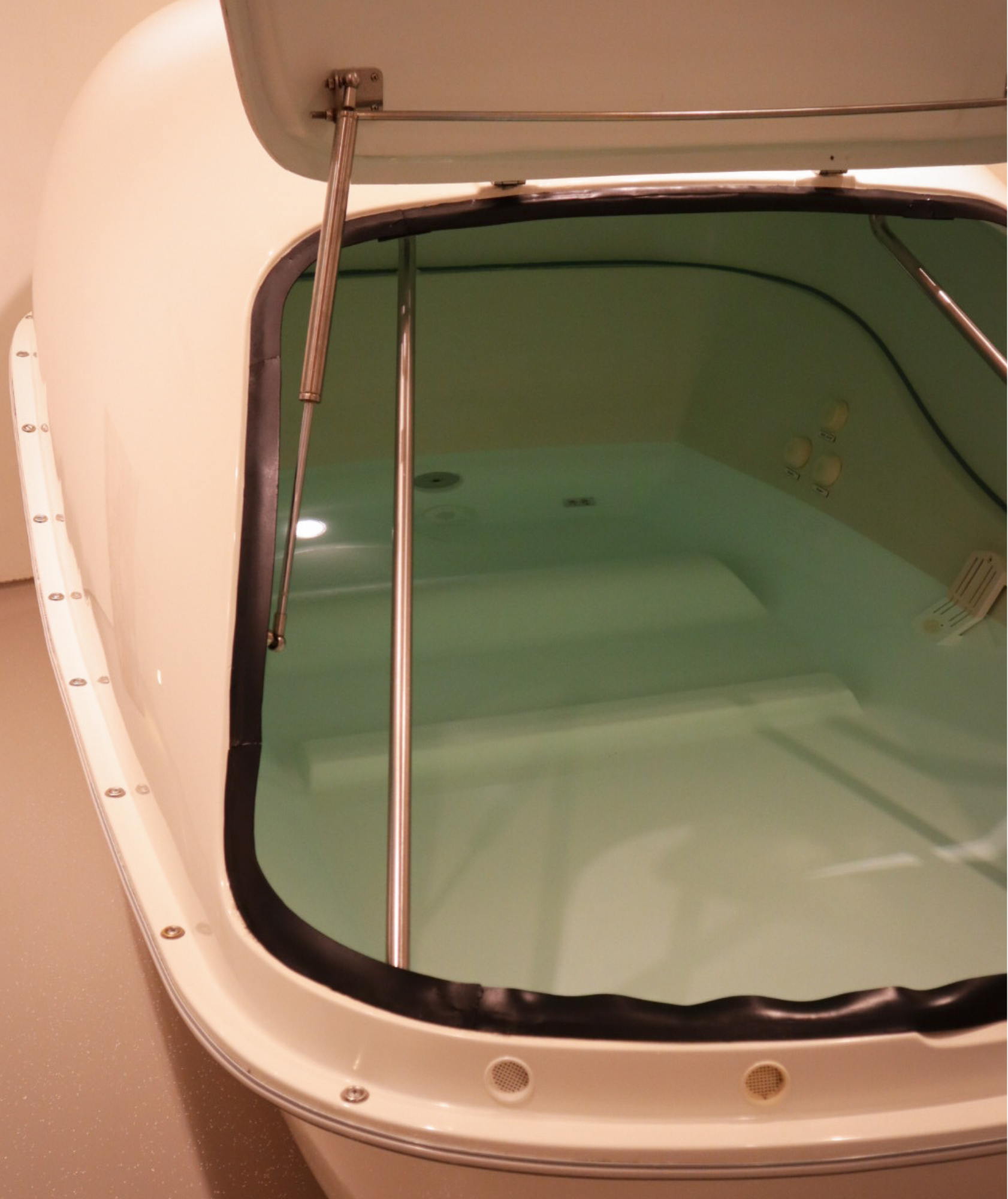 Modern float cabin filled with warm Epsom saltwater at Koan Float Amsterdam spa